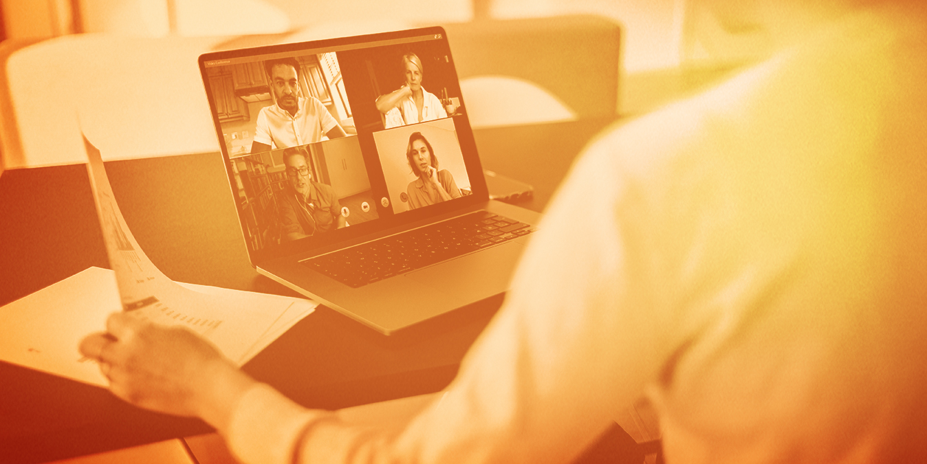 Person looking at laptop for a video call with 4 other co-workers