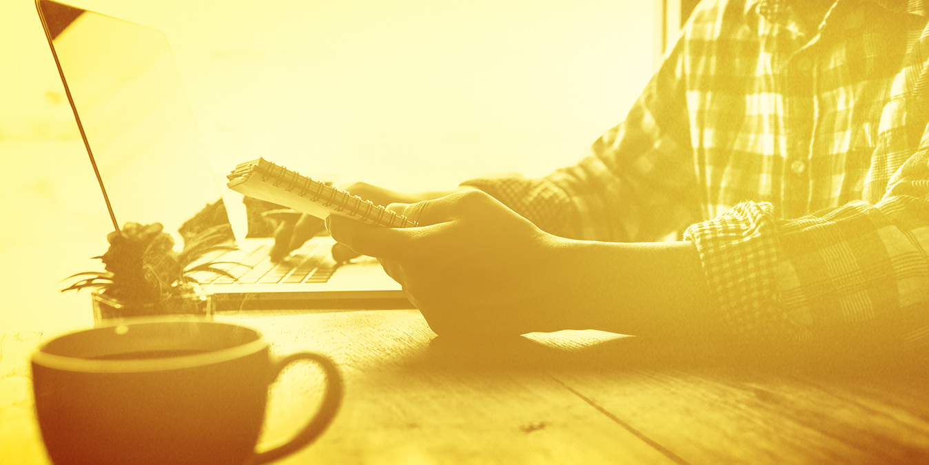 Man using a computer with coffee